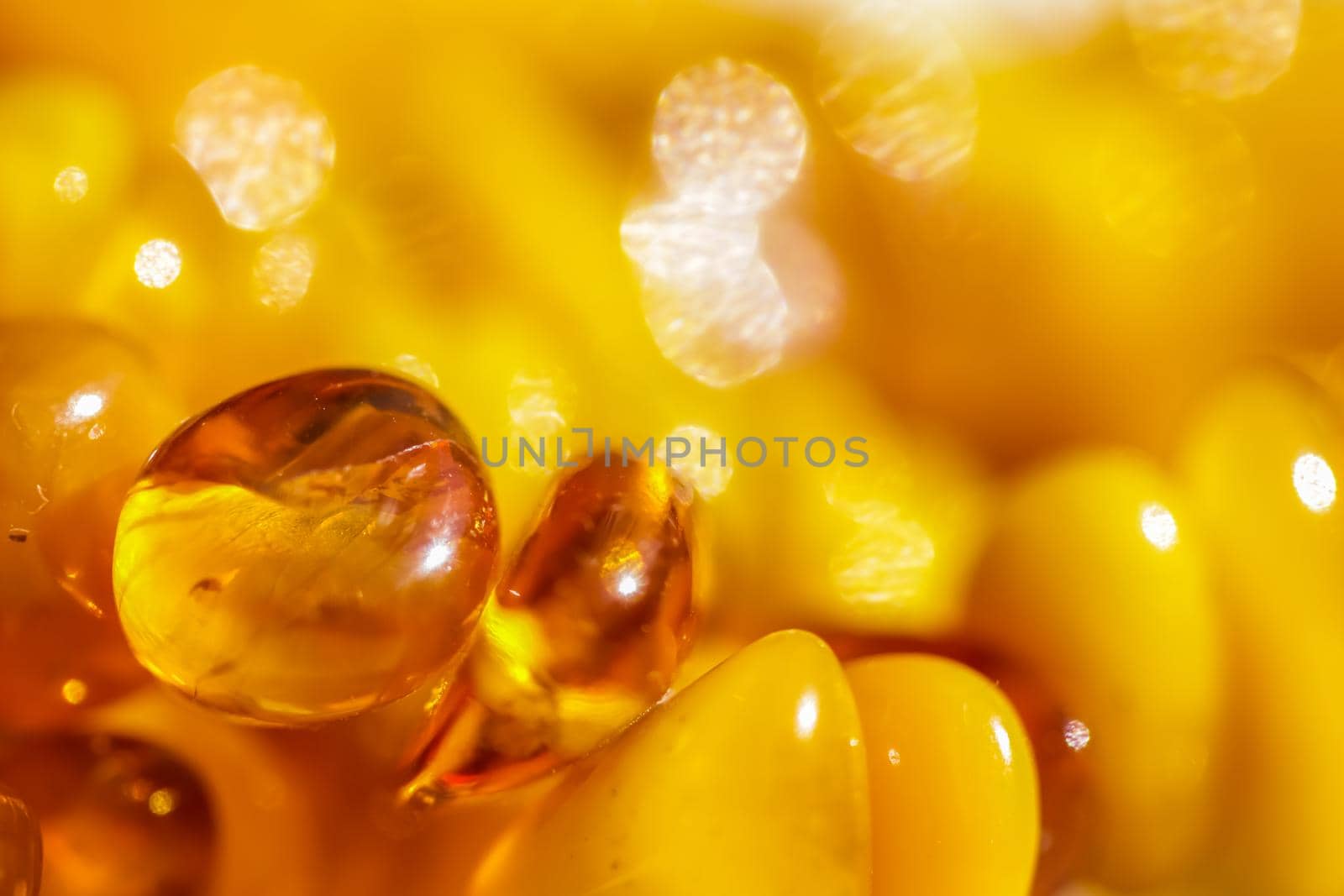 Sunny beads of fire amber. Natural gemstone background, jewelry concept