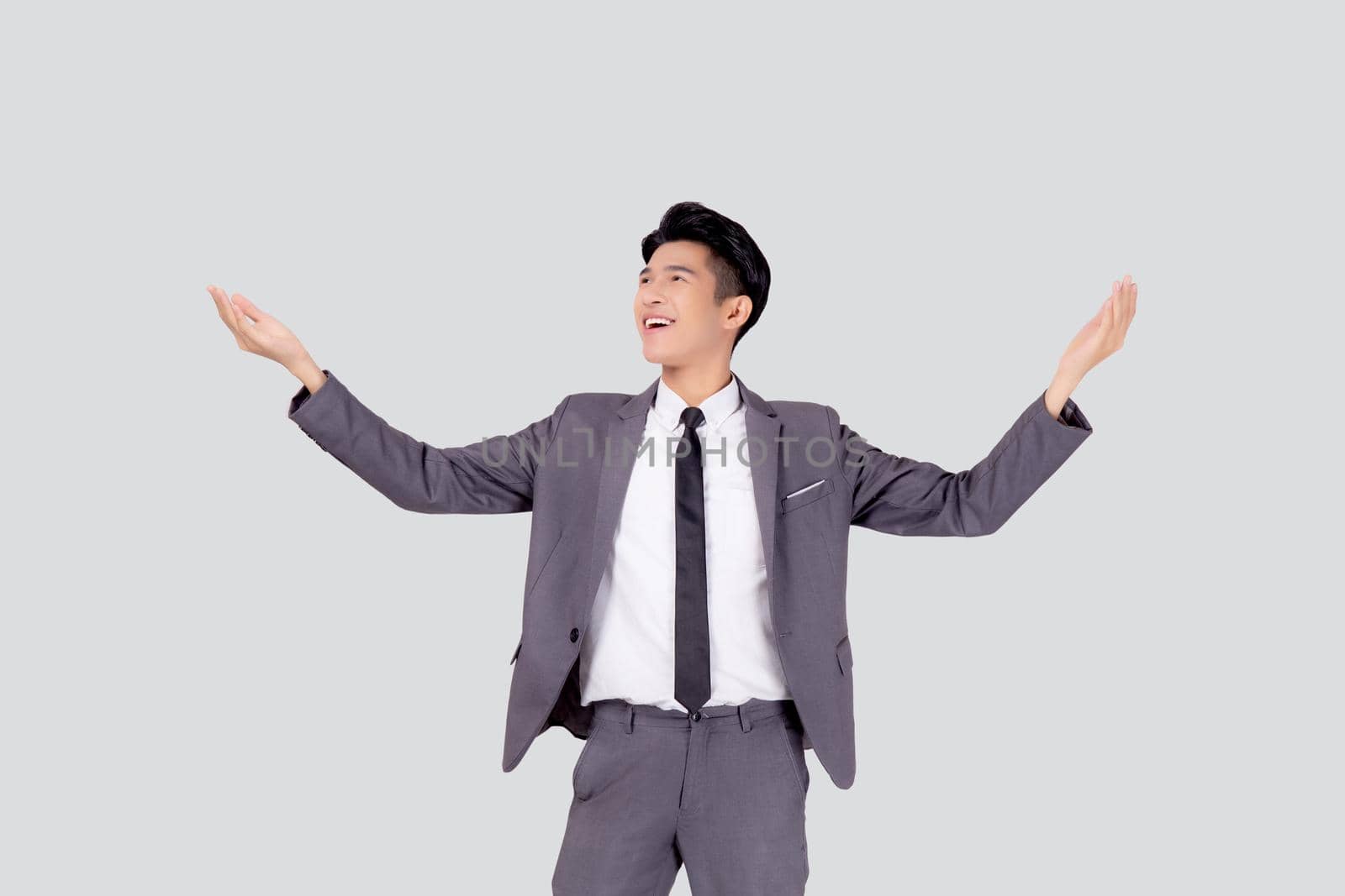 Portrait businessman in suit standing with win success isolated on white background, young asian business man is manager or executive having confident and excited is positive, expression and emotion.