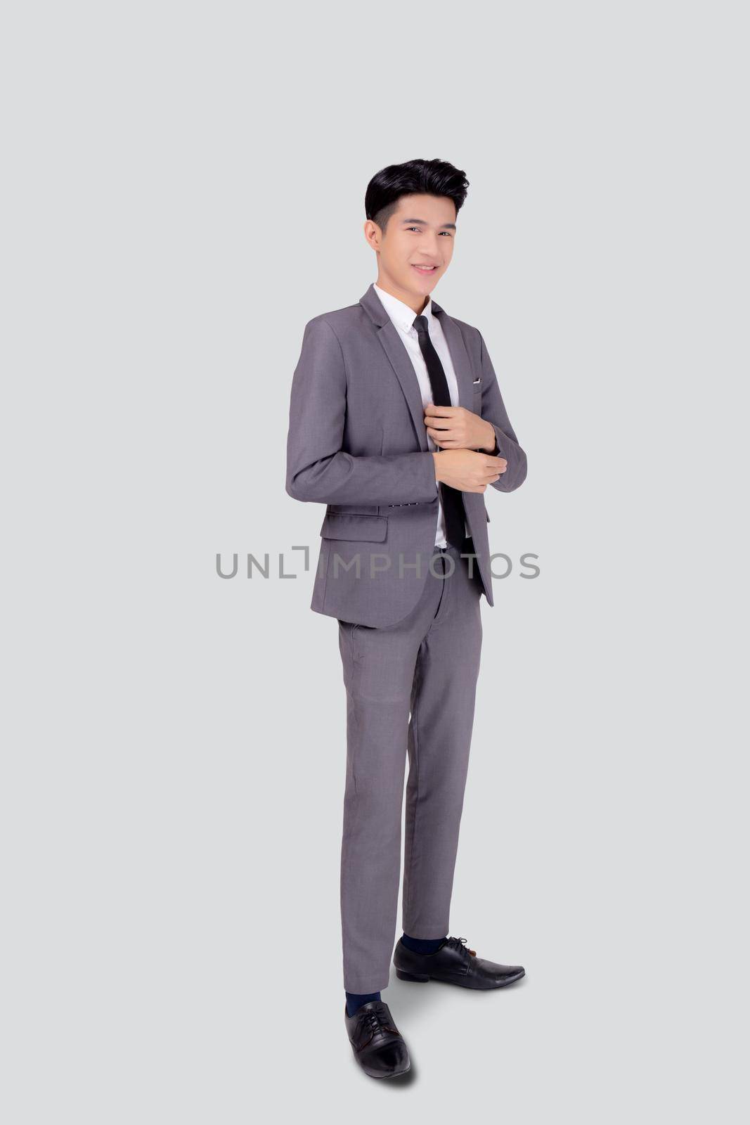 Portrait young asian businessman in suit smiling with confident and friendly isolated on white background, business man smart with success, manager or executive with handsome and leadership.