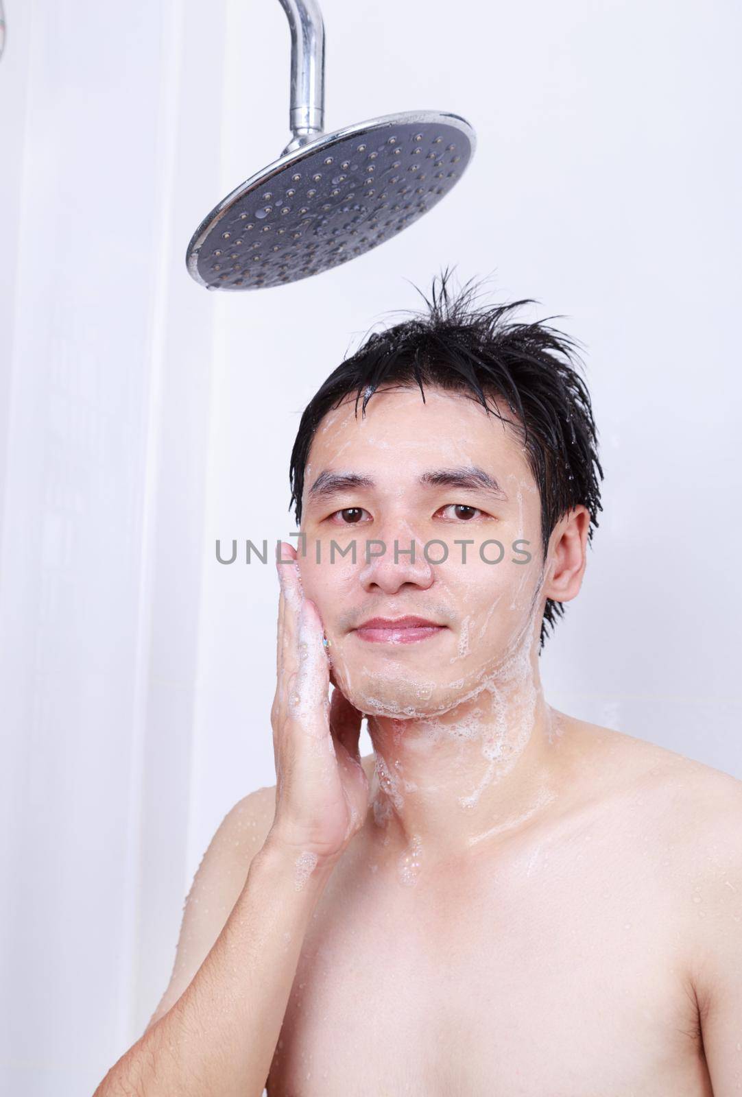 man washing face in the bathroom by geargodz