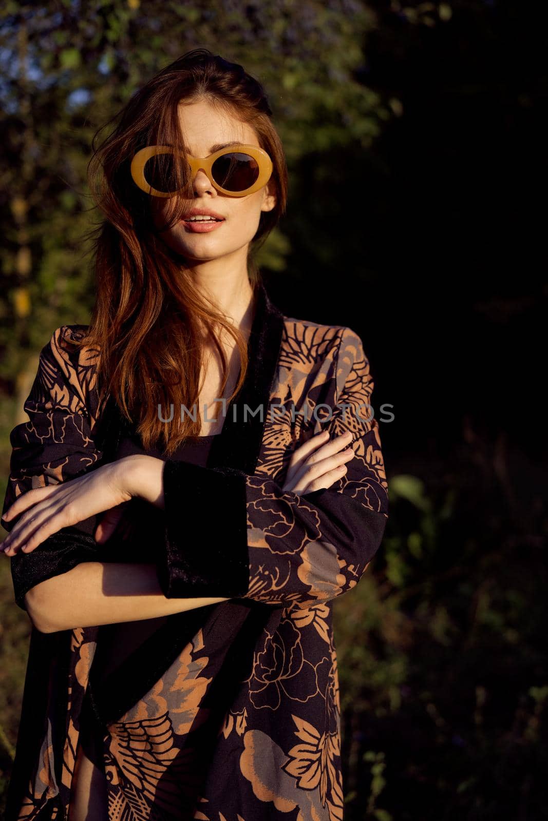 woman wearing sunglasses outdoors posing fashion. High quality photo