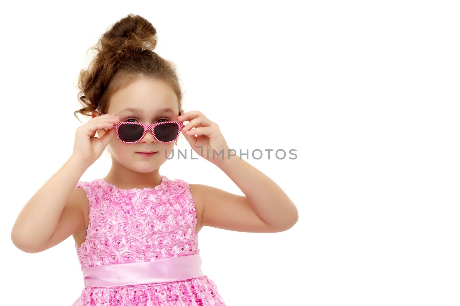Fashionable little girl in sunglasses. The concept of outdoor recreation, tourism. Isolated on white background.