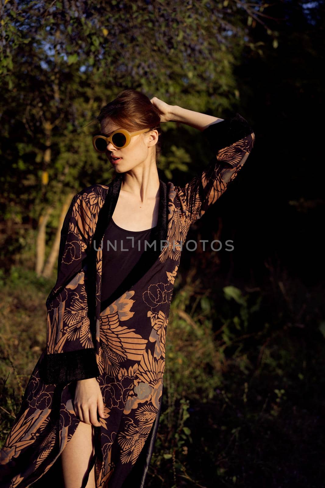 pretty woman in fashionable clothes sunglasses nature posing by Vichizh
