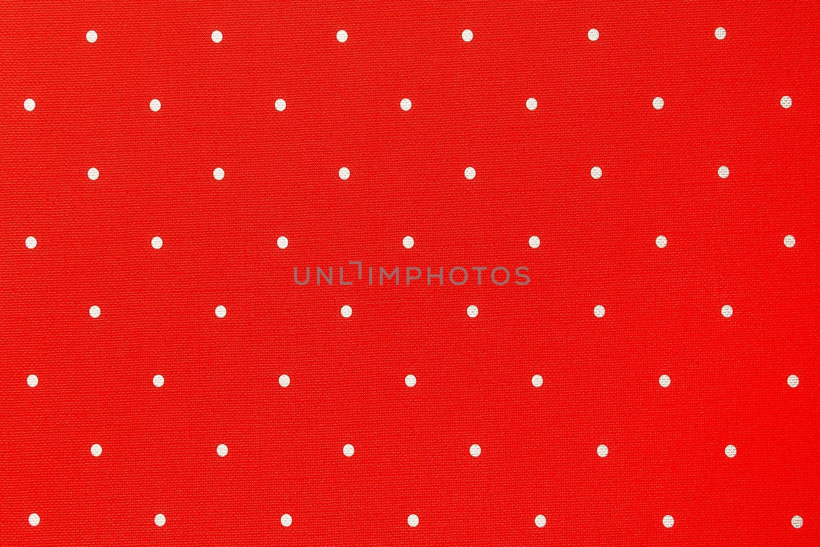 Red seamless texture with white polka dots abstract pattern background.