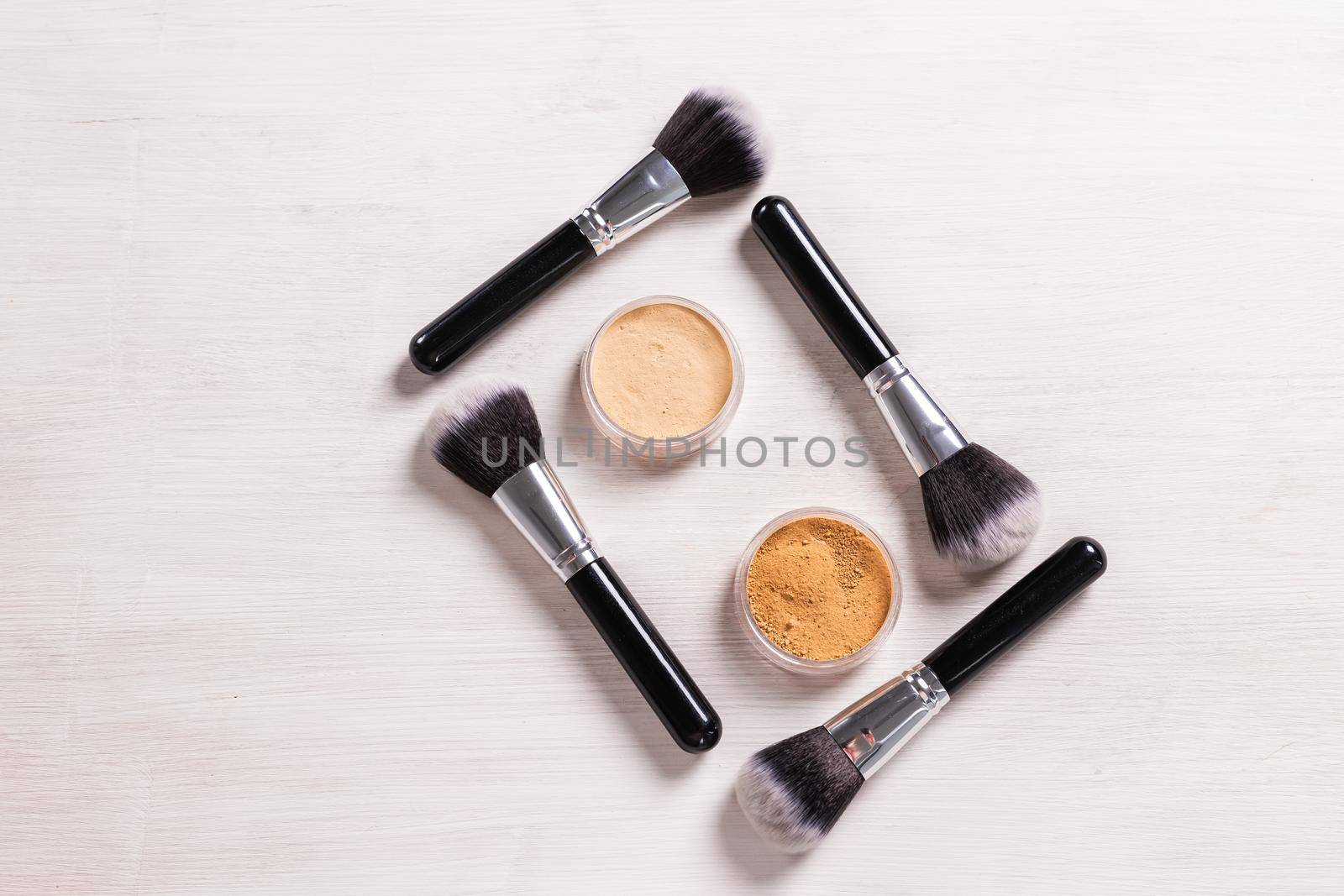 Mineral face powder and brush. Eco-friendly and organic beauty products.