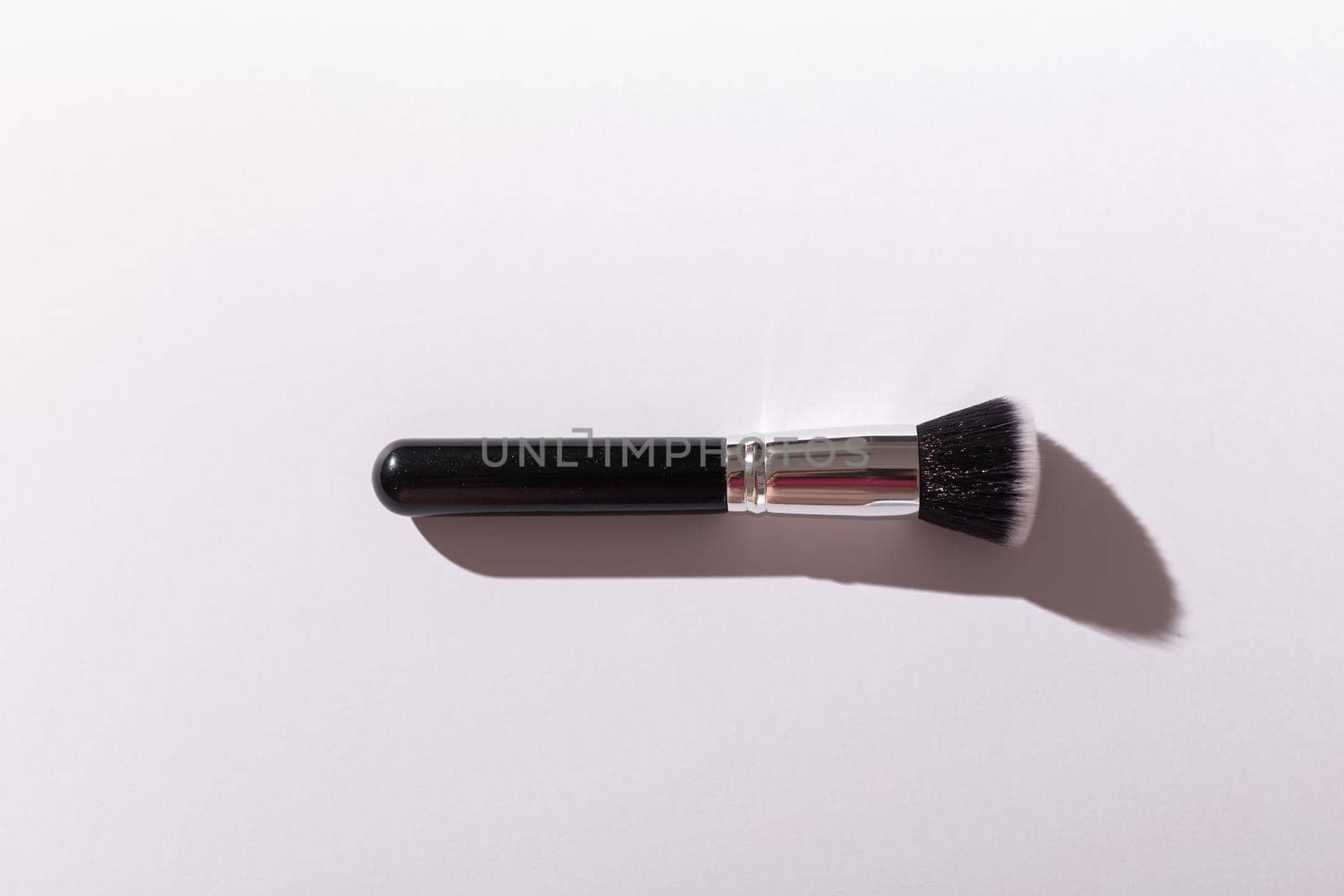 Make up brush on white background, top view