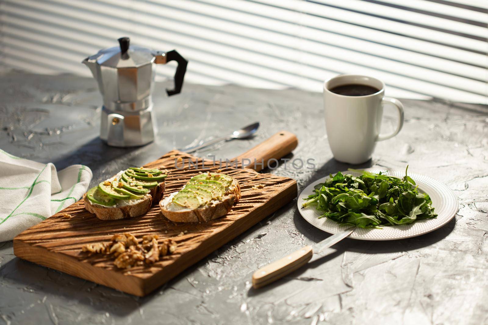 sliced avocado on toast bread with spices.