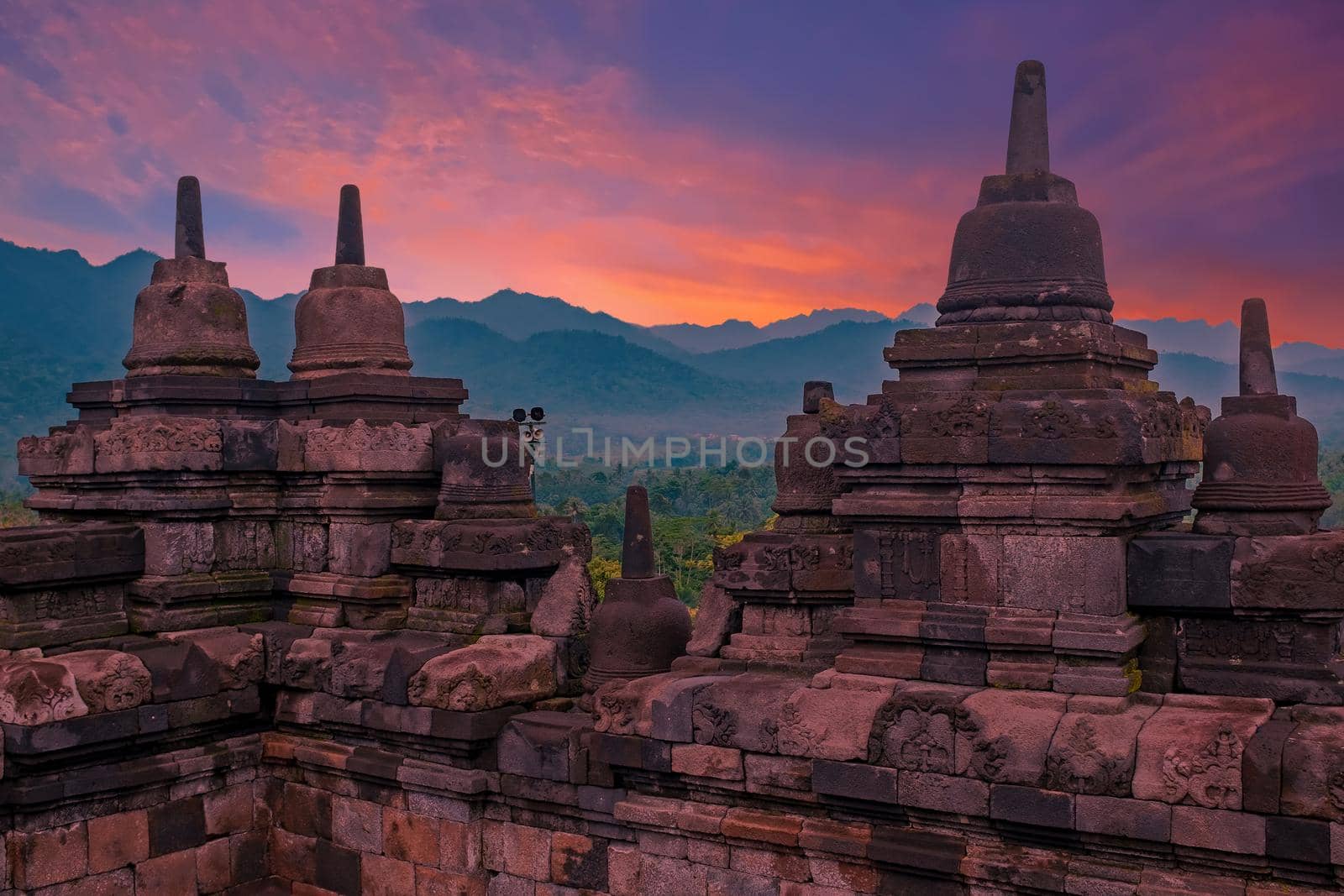 Borobudur Temple in Central Java in Indonesia. This famous Buddhist temple is dating from the 8th and 9th centuries at sunset