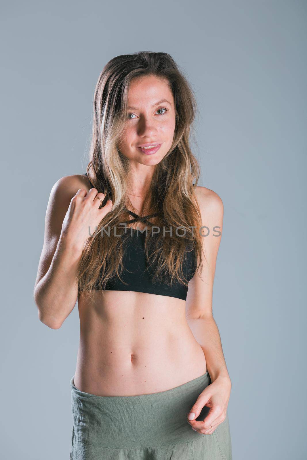 Portrait of young slim fitness woman. Sport and healthy lifestyle concept. by Satura86