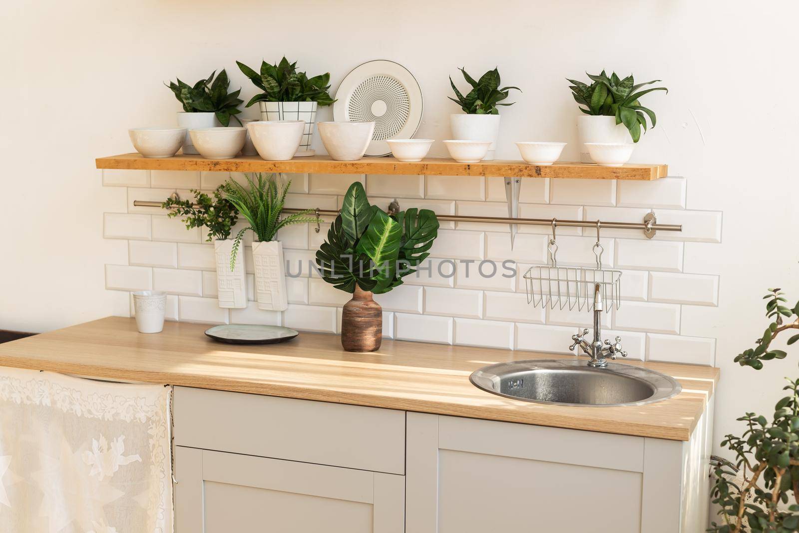 Stylish scandinavian open space with kitchen accessories and plants. by Satura86