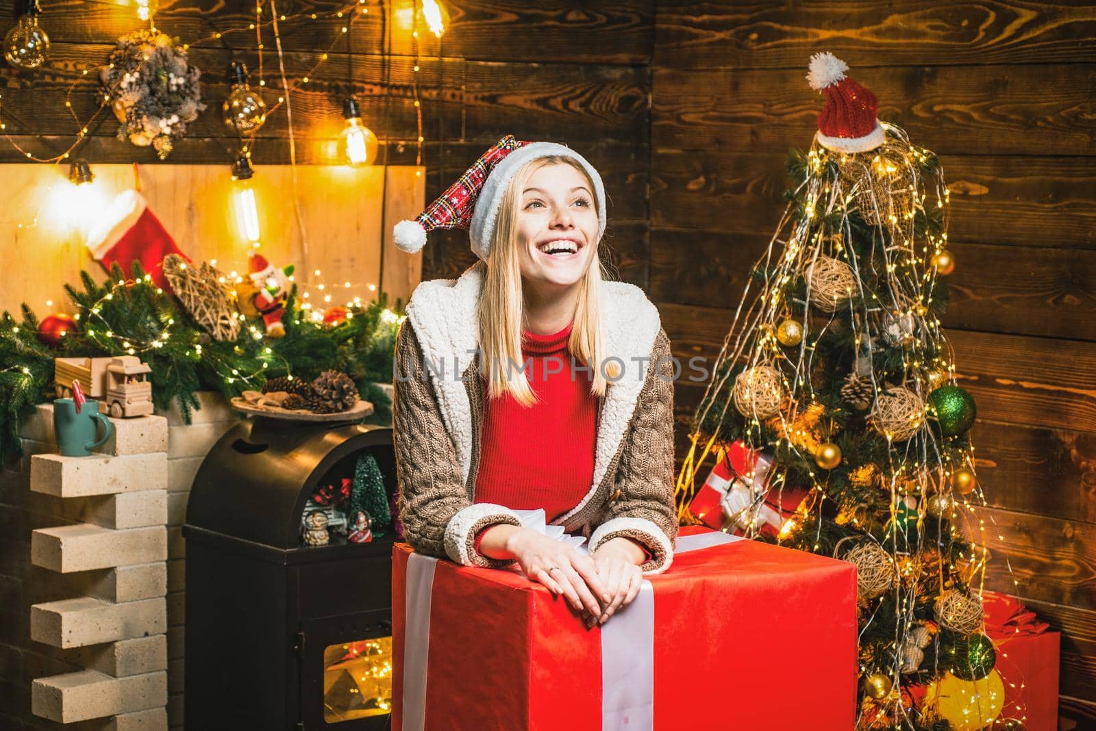 Girl enjoy cozy warm christmas atmosphere at home. Christmas joy by Tverdokhlib