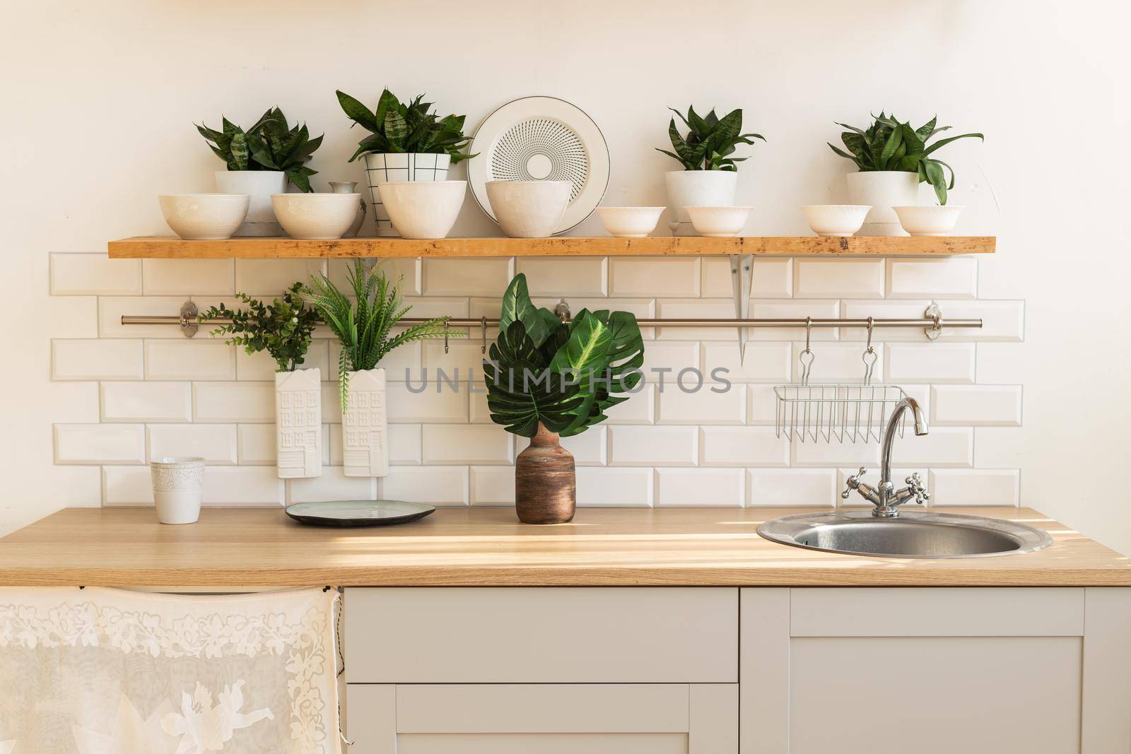 Home interior of a trendy, stylish, bright Scandinavian-style kitchen with open shelves. Loft interior.