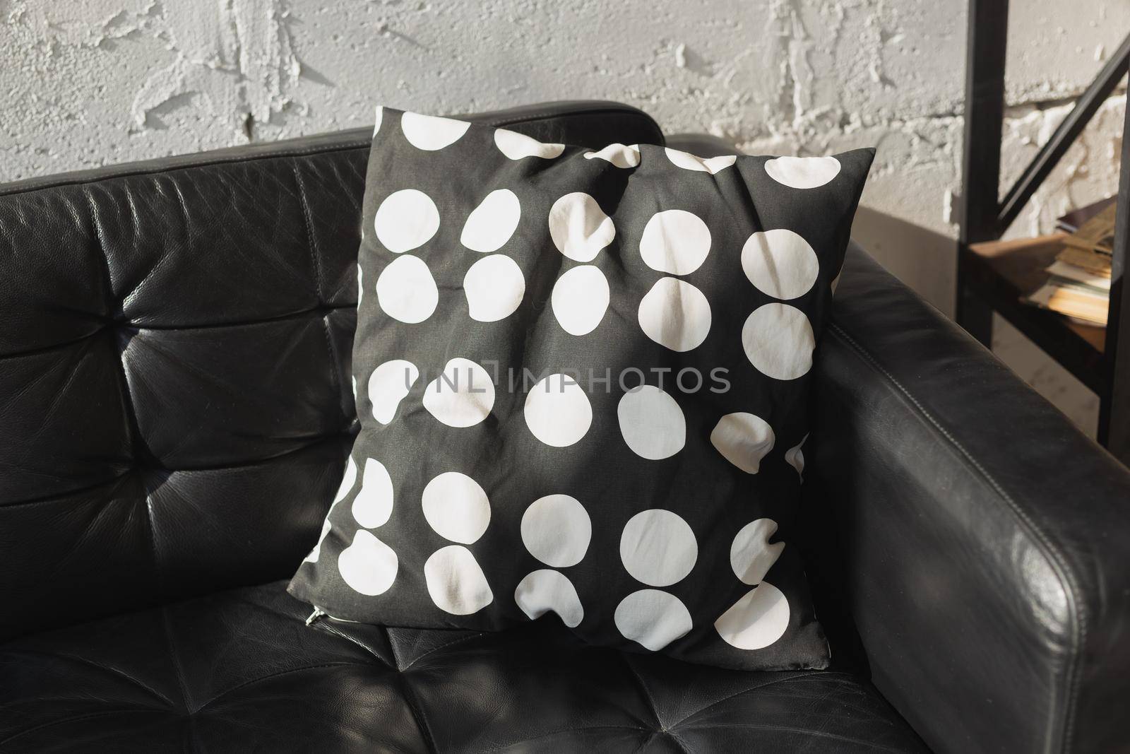 Black and white cushions on a sofa. Modern furniture.