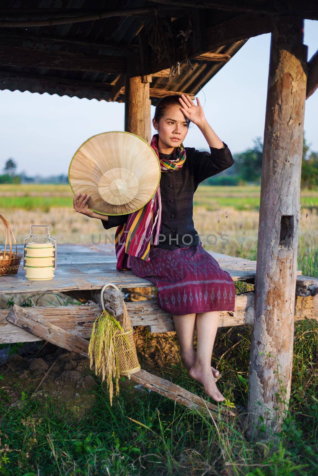 farmer woman sitting in cottage and her tired, Thailand