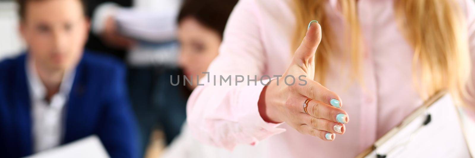 Businesswoman offer hand to shake as hello in office closeup. Serious business, friendly support service, excellent prospect, introduction or thanks gesture, gratitude, invite to participate concept