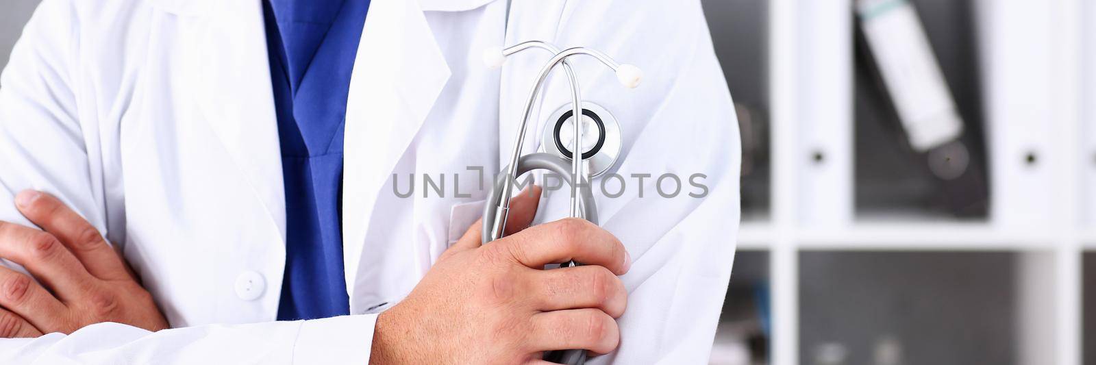 Male medicine doctor arms crossed on his chest in office. Medic store, physical and patient disease prevention, er consultant body, 911, profession, pulse measure, healthy lifestyle concept