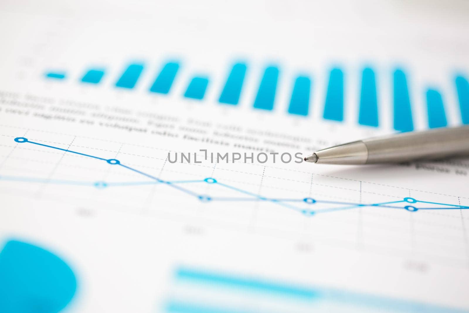 Financial statistics documents ball pen infographics at office table by kuprevich