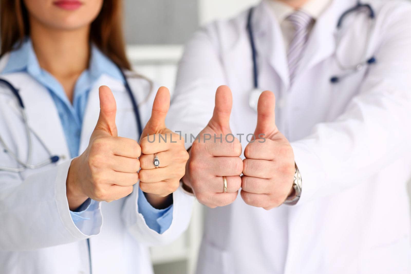 Group of doctor hands show OK or confirm sign by kuprevich