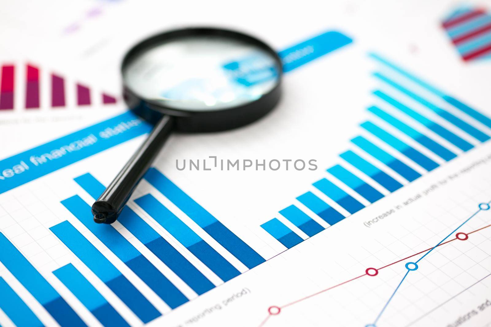 Financial statistics documents with lens at office table closeup. Internal Revenue Service inspector sum check, irs investigation, exchange market, earnings, savings, loan and credit concept