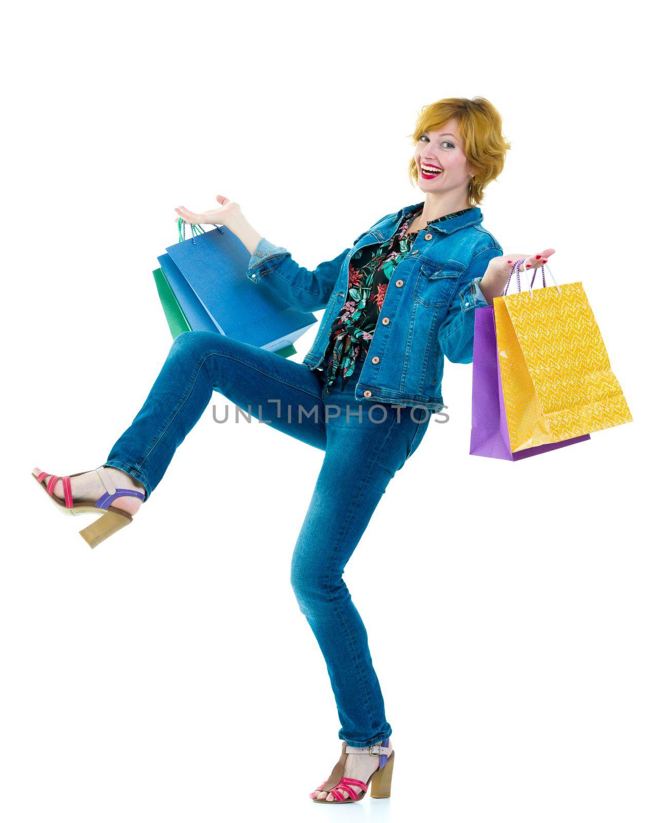 A woman hand carrying a bunch of shopping bags isolated on white by kolesnikov_studio