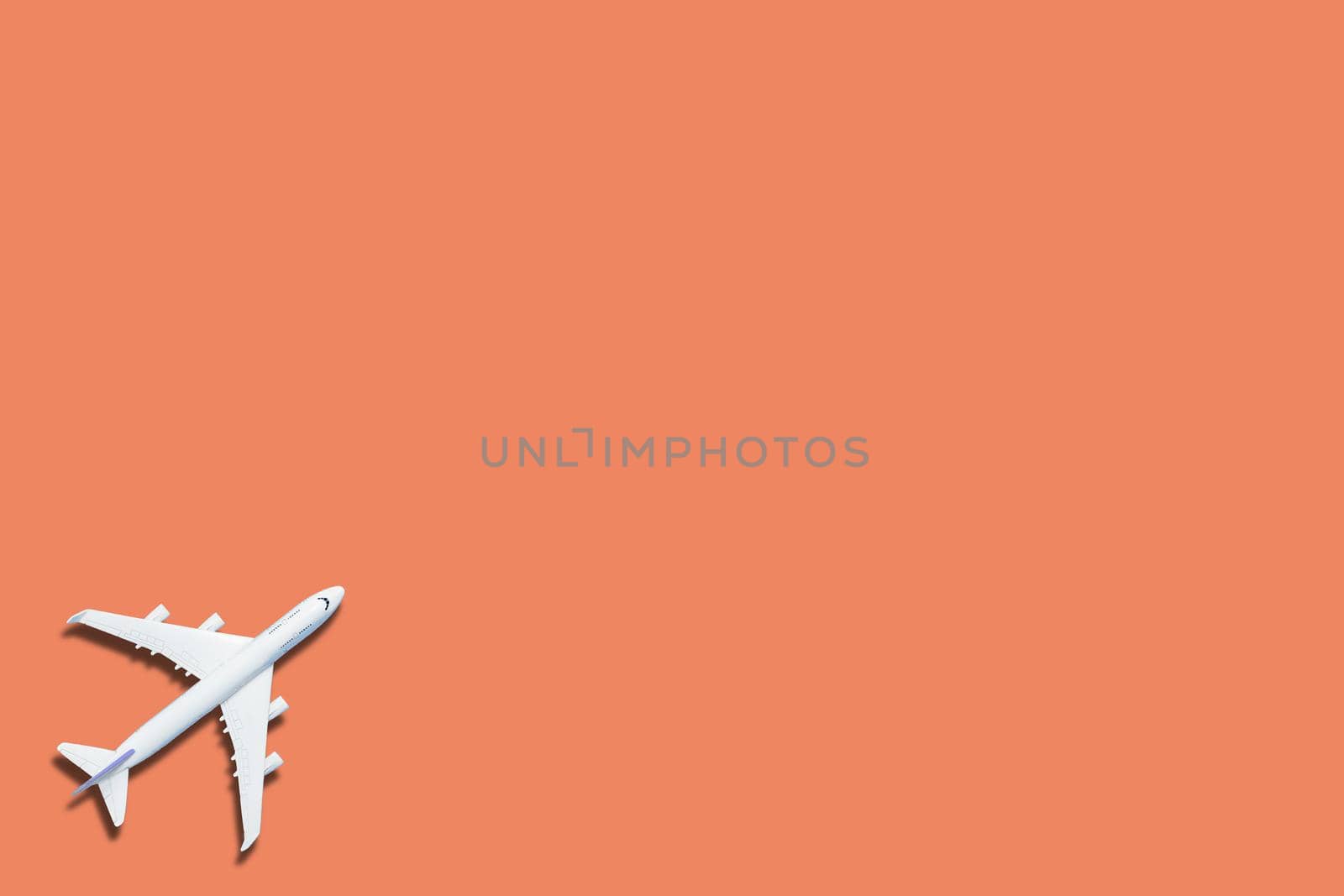 airplane figure on pink background