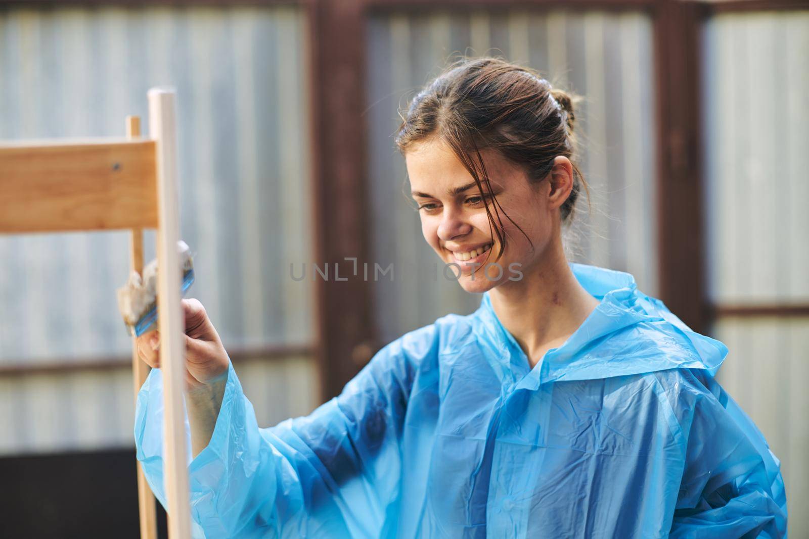 women paint wooden structures brush painter decoration. High quality photo