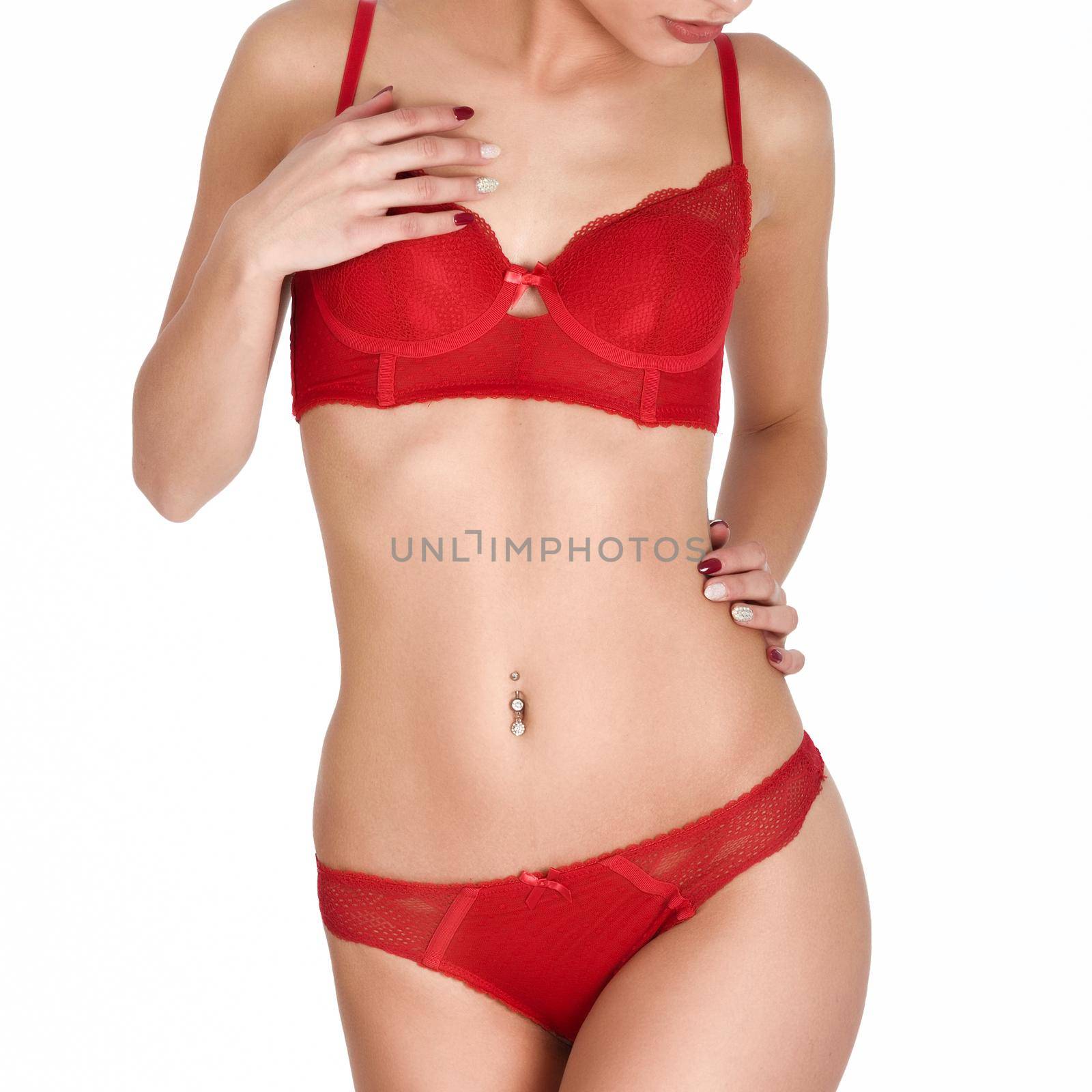 Unrecognizable woman, model of fashion, wearing red underwear. Young girl in lingerie. Studio shot.
