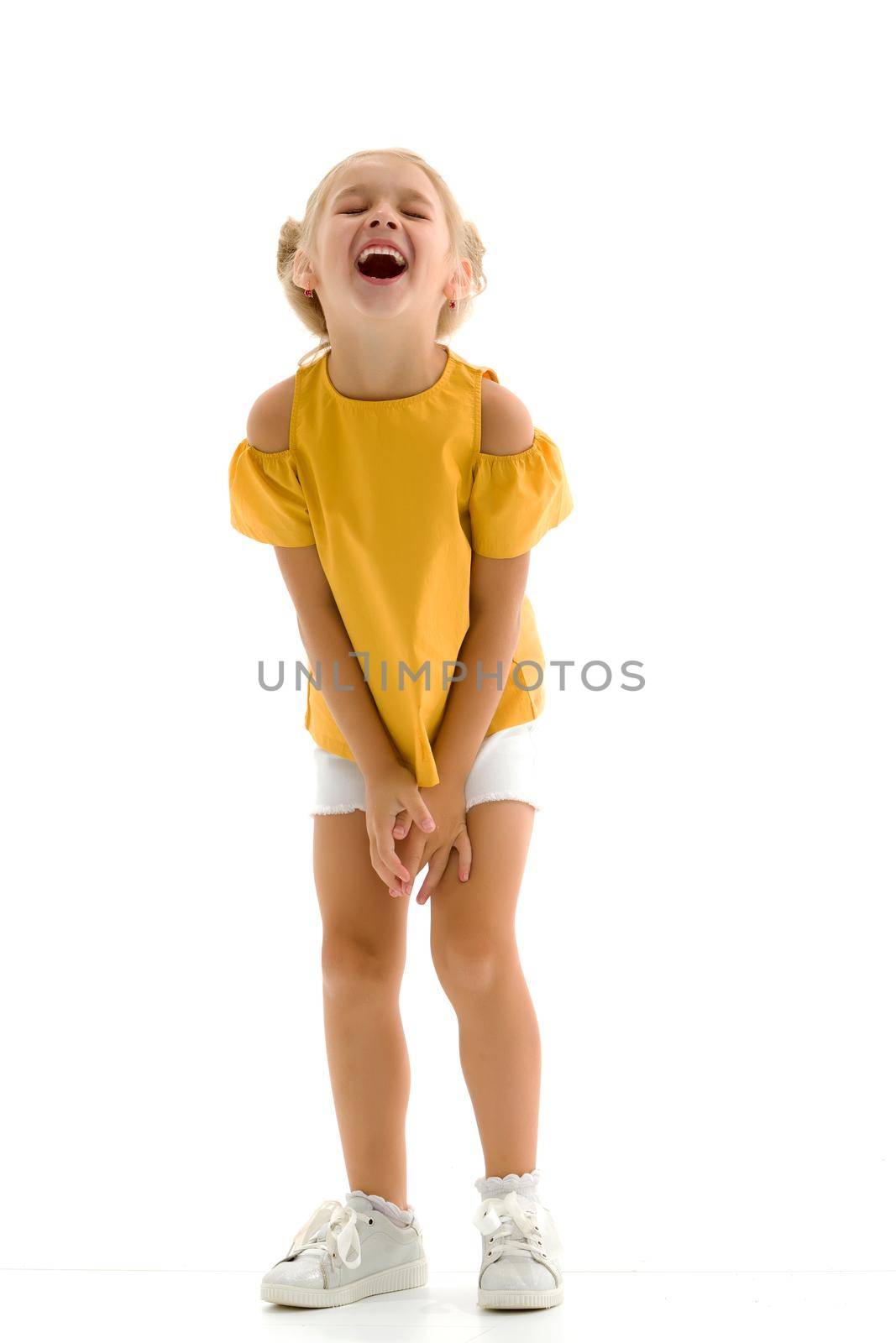 Beautiful little girl laughing. The concept of a happy childhood, emotions. Isolated on white background.