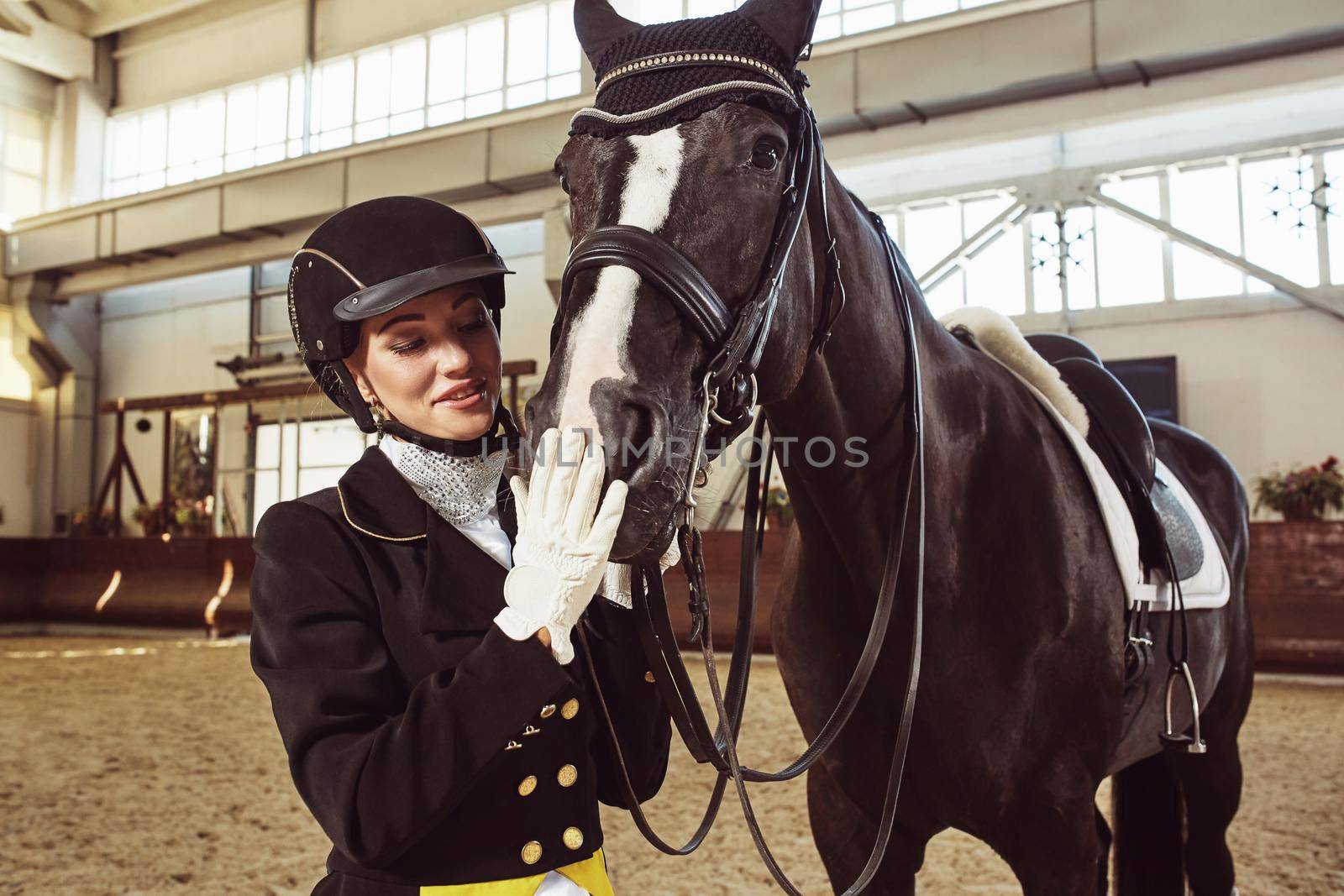woman jockey with his horse in uniform for Dressage