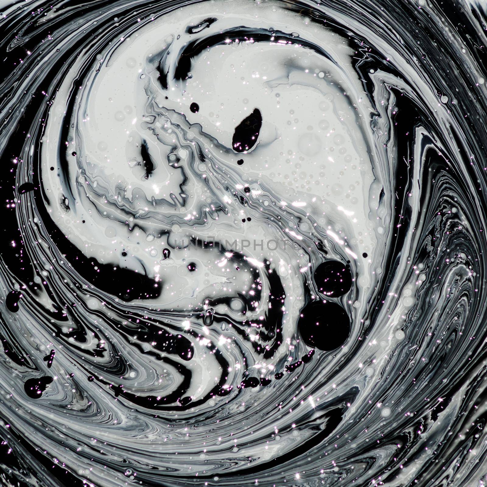 abstract image mixing of two colors. The texture of the circles of white and black paint - image