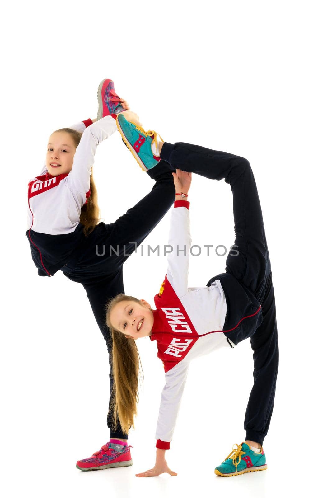 Girls gymnasts perform exercises. The concept of strength, health and sport. Isolated on white background.