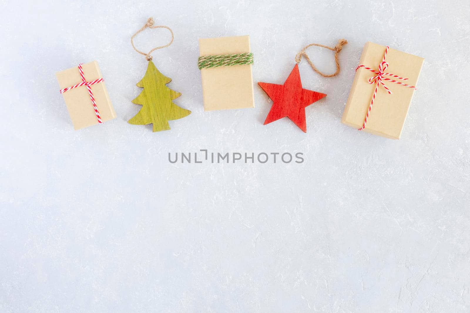 Christmas composition made of gift boxes and wooden decoration, top view, copy space