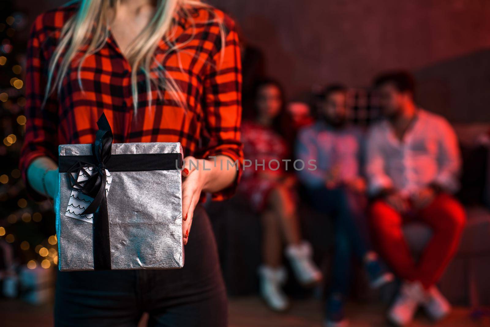 Christmas, x-mas, New year, winter, happiness concept - smiling woman with gift box. Funny people. Christmas party at home