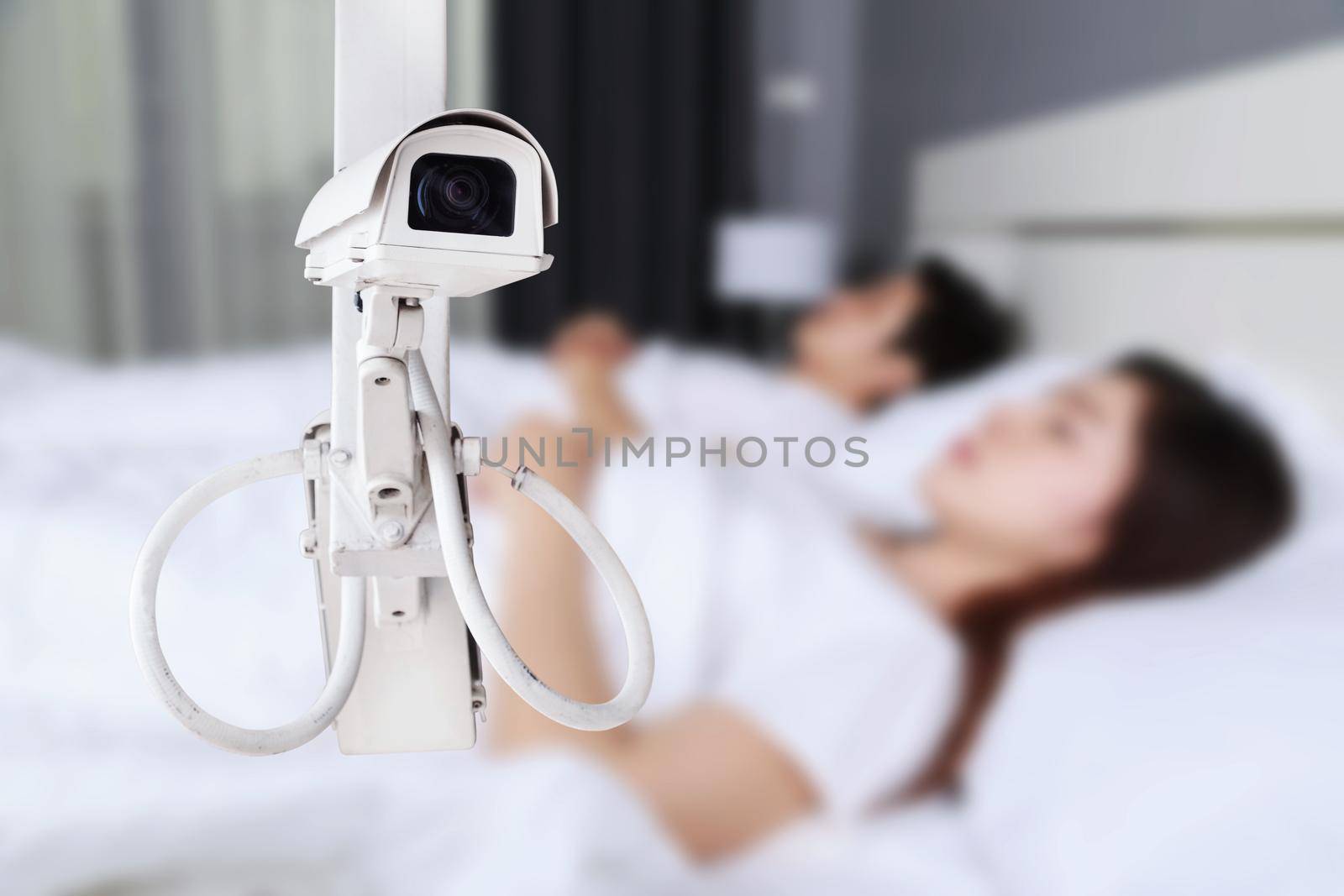 CCTV Camera or surveillance operating with couple sleeping in bedroom