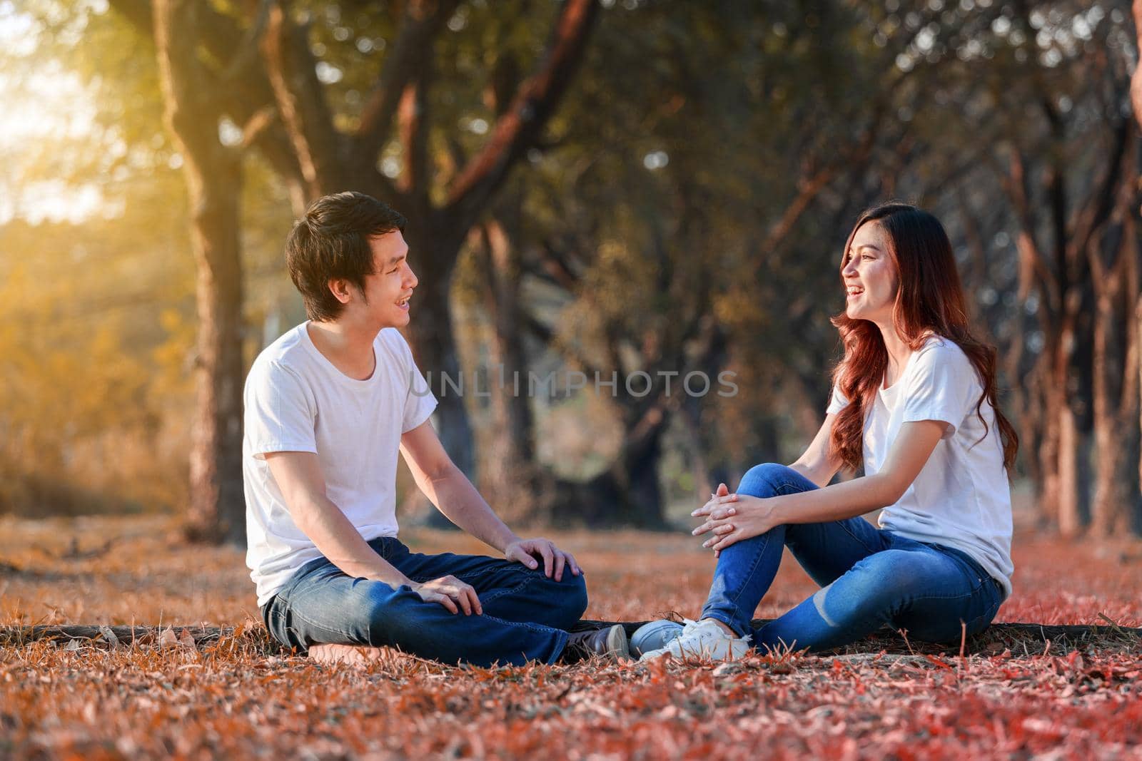 young couple talking and laghing in the park