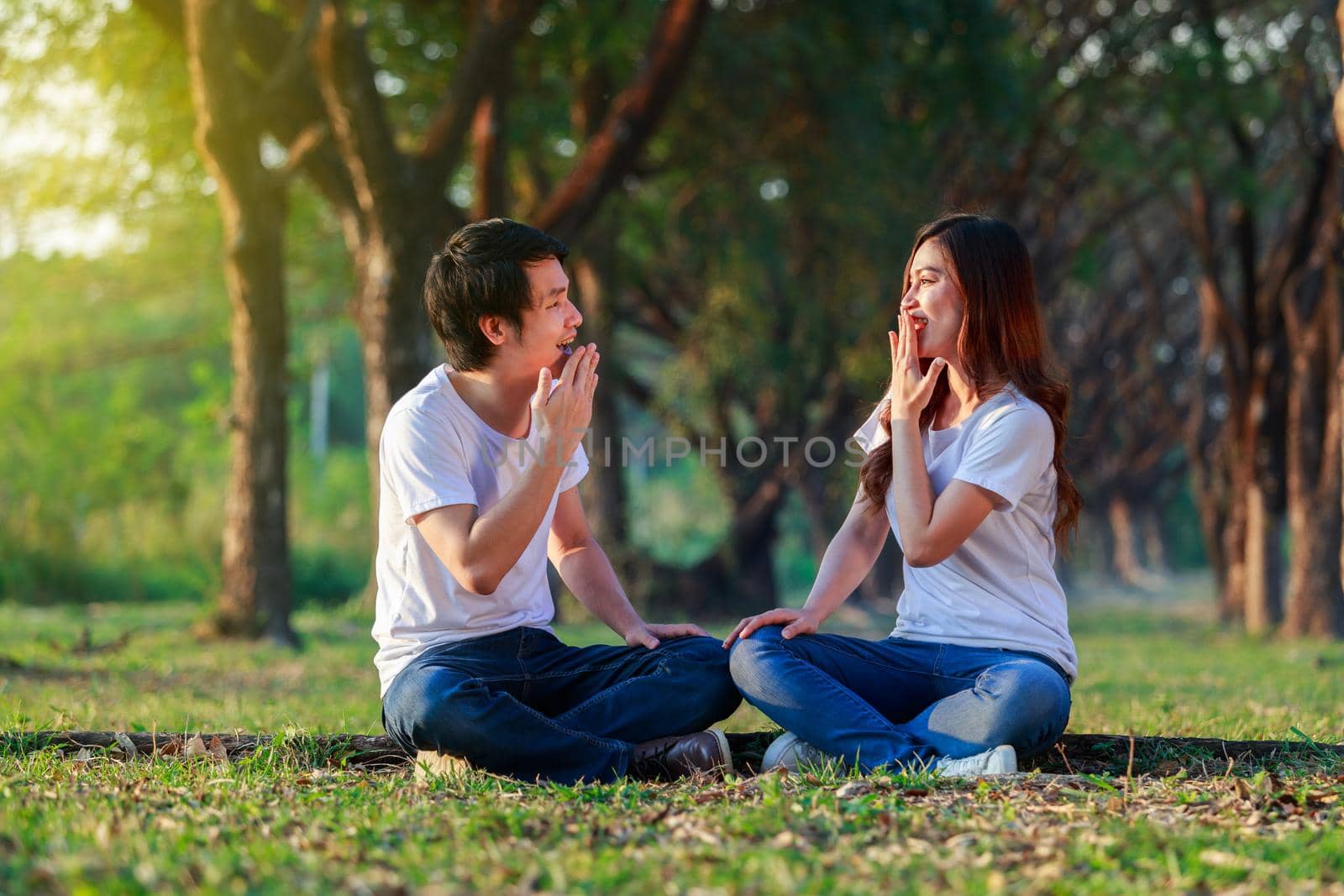 young couple talking and laghing in the park