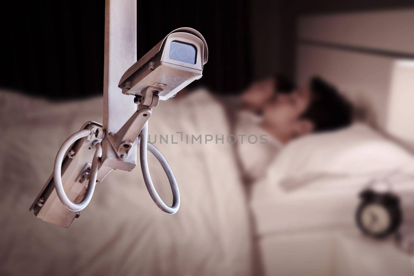 CCTV Camera or surveillance operating with couple sleeping in bedroom