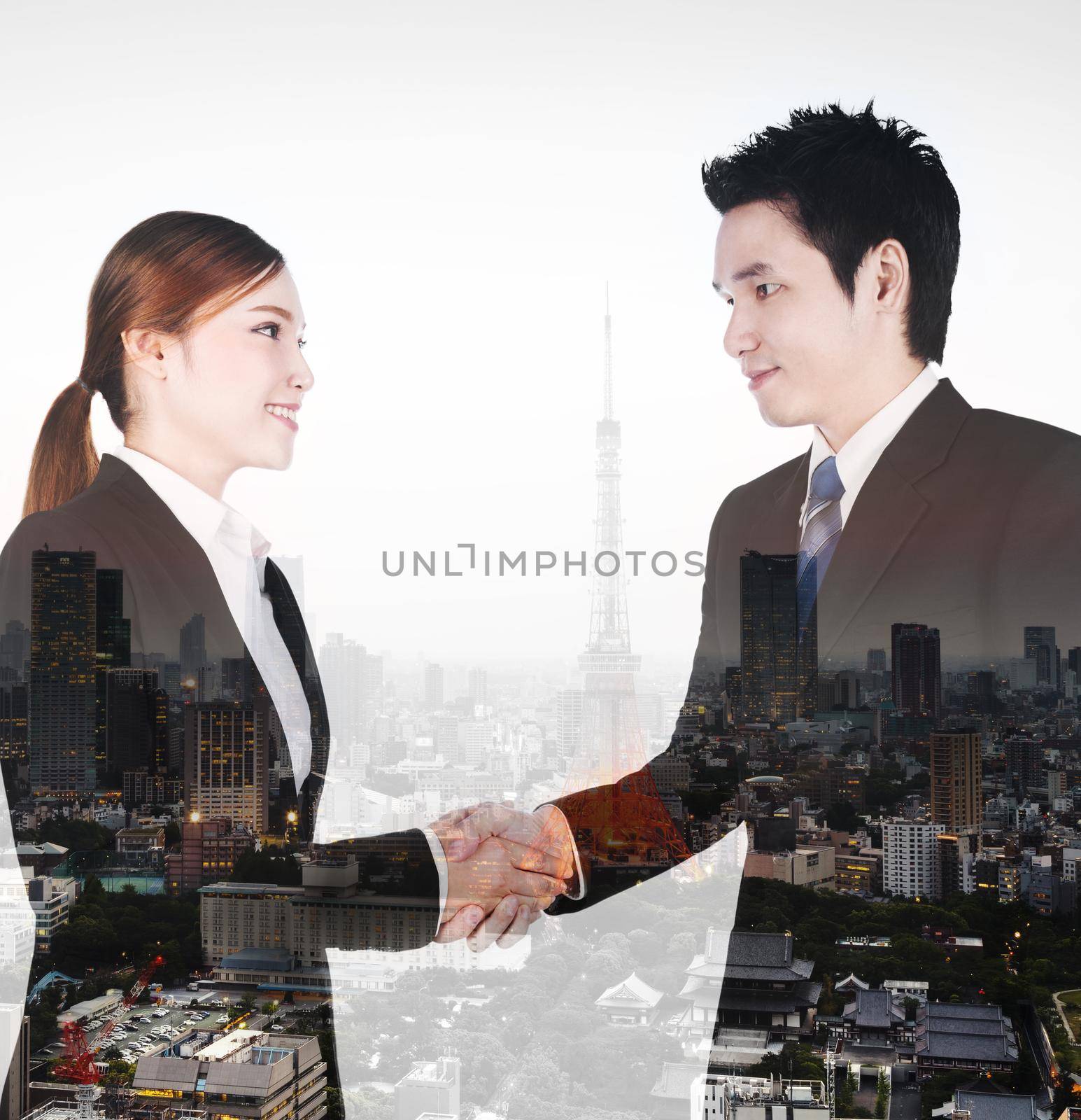 double exposure of shaking hand between businessman and businesswoman with city background by geargodz