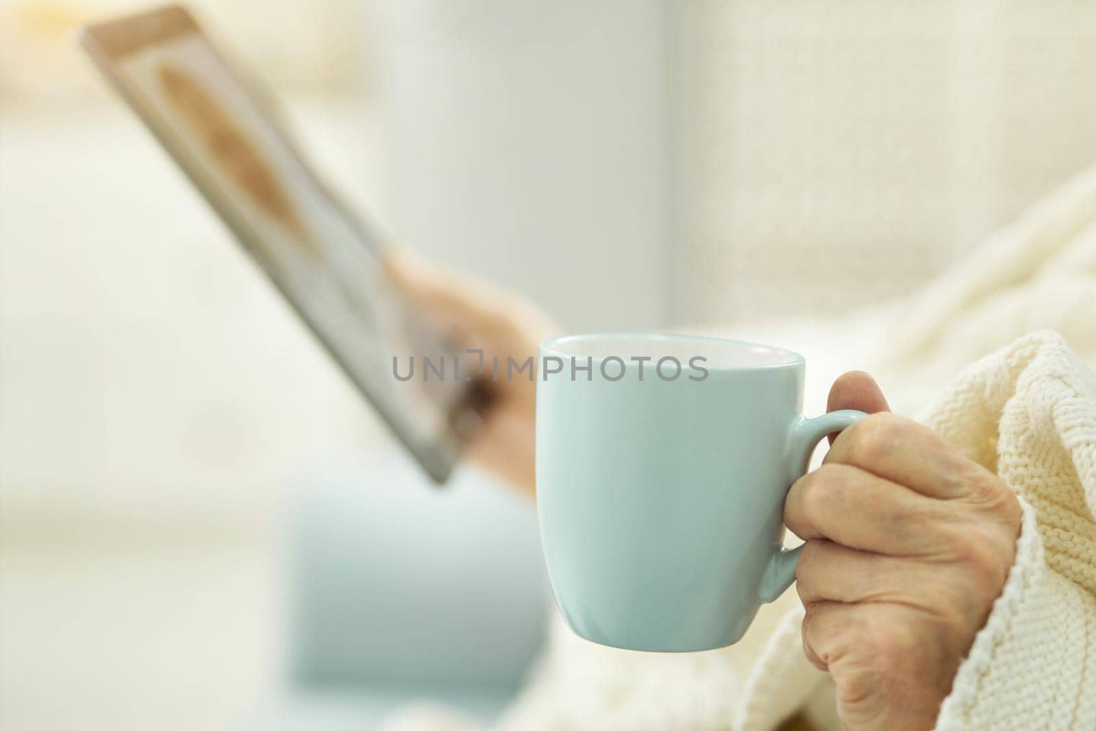 Close up of adult person consulting medical specialsit via internet with a help of a tablet