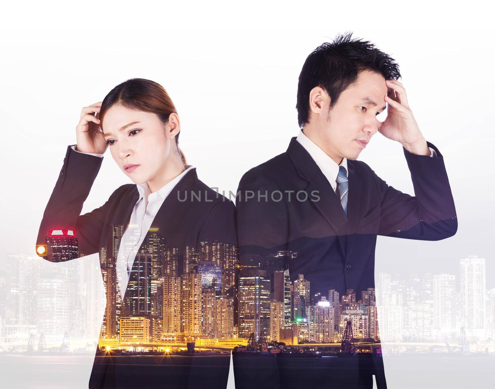 double exposure of worried business man and woman with a city background