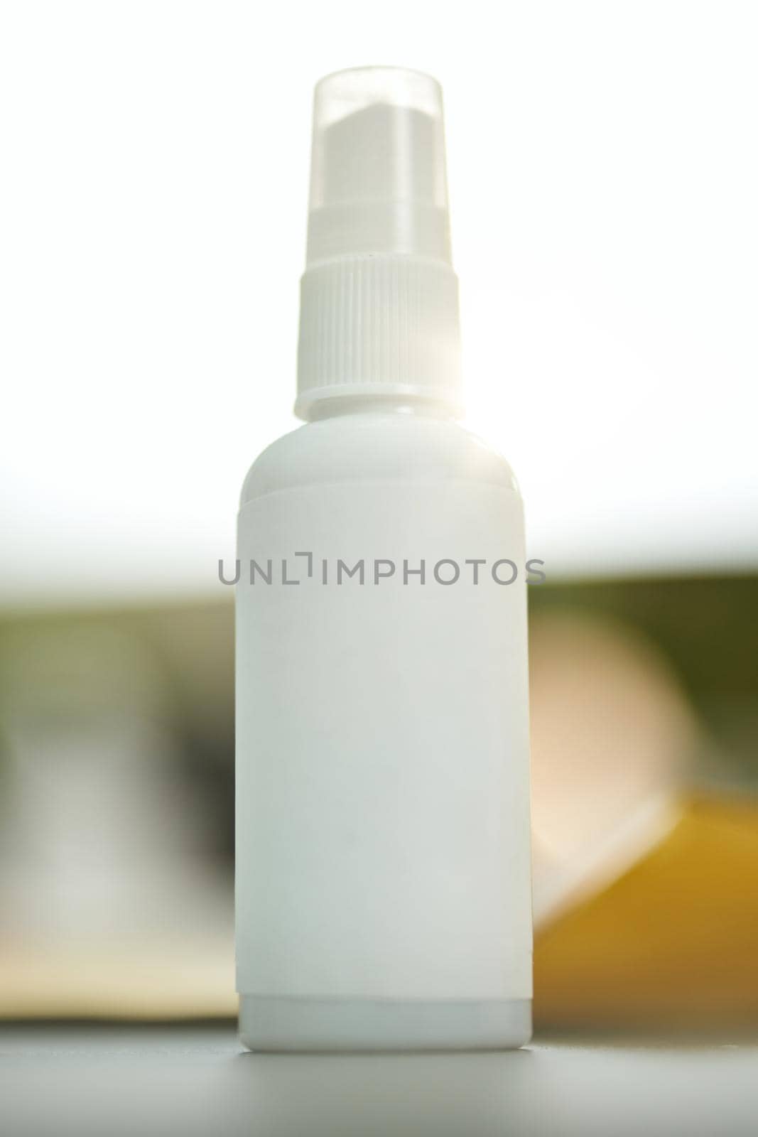 Copy space photo of a little generic blank spray bottle with a lid on