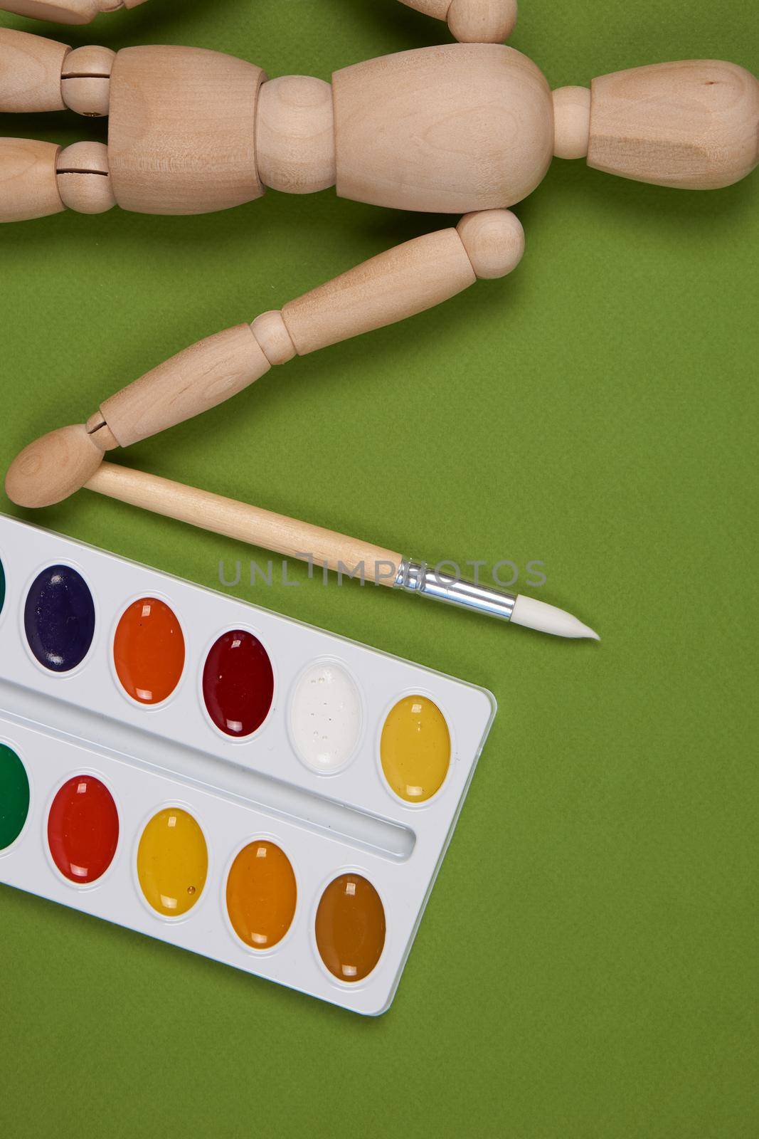 wooden mockup for painting paint brush art green background. High quality photo