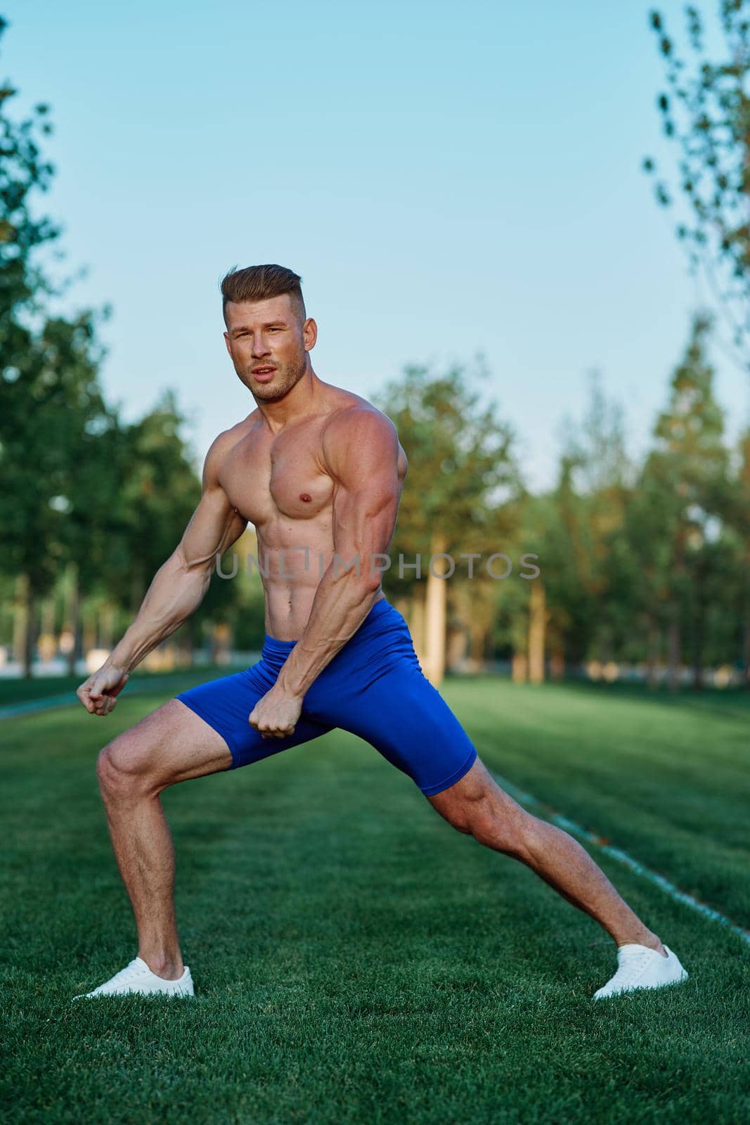 man doing exercises in the park inflated body by Vichizh