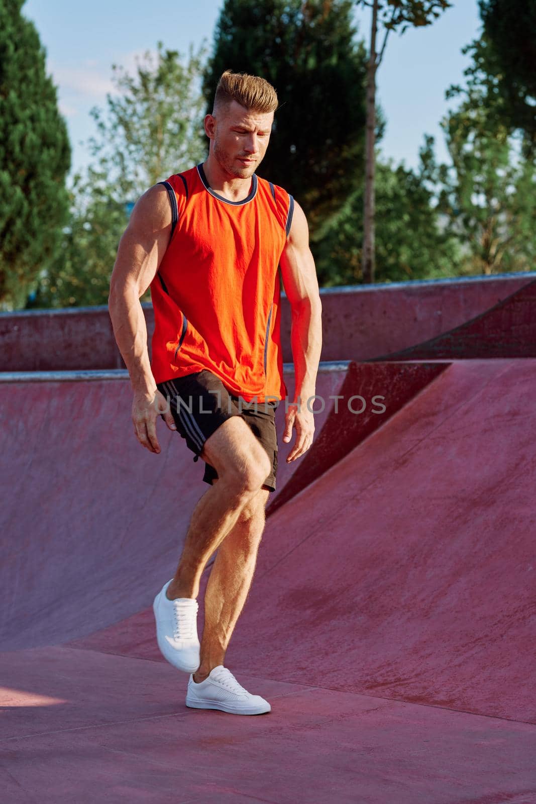 man doing exercises outdoors in the park. High quality photo