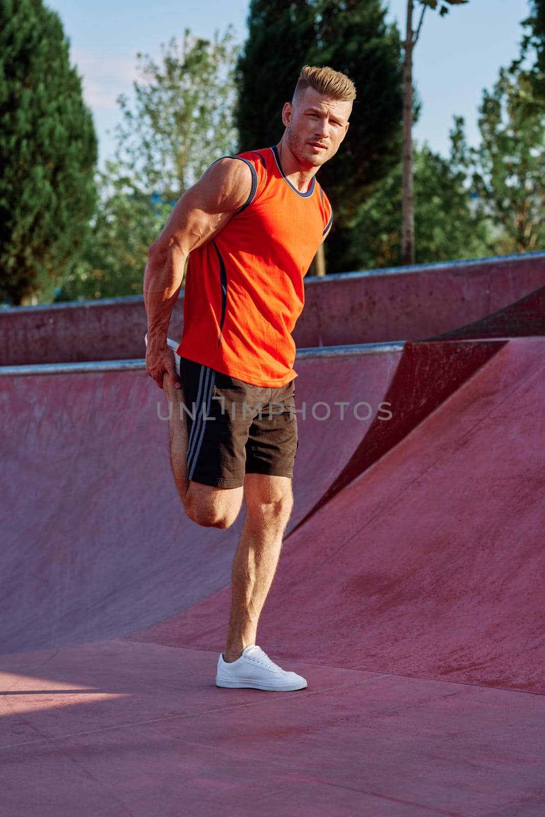 sports man on the playground in the park workout. High quality photo