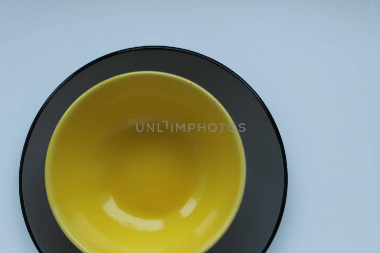 plates of yellow gray on a light white background with a ist for text and a copyspace.