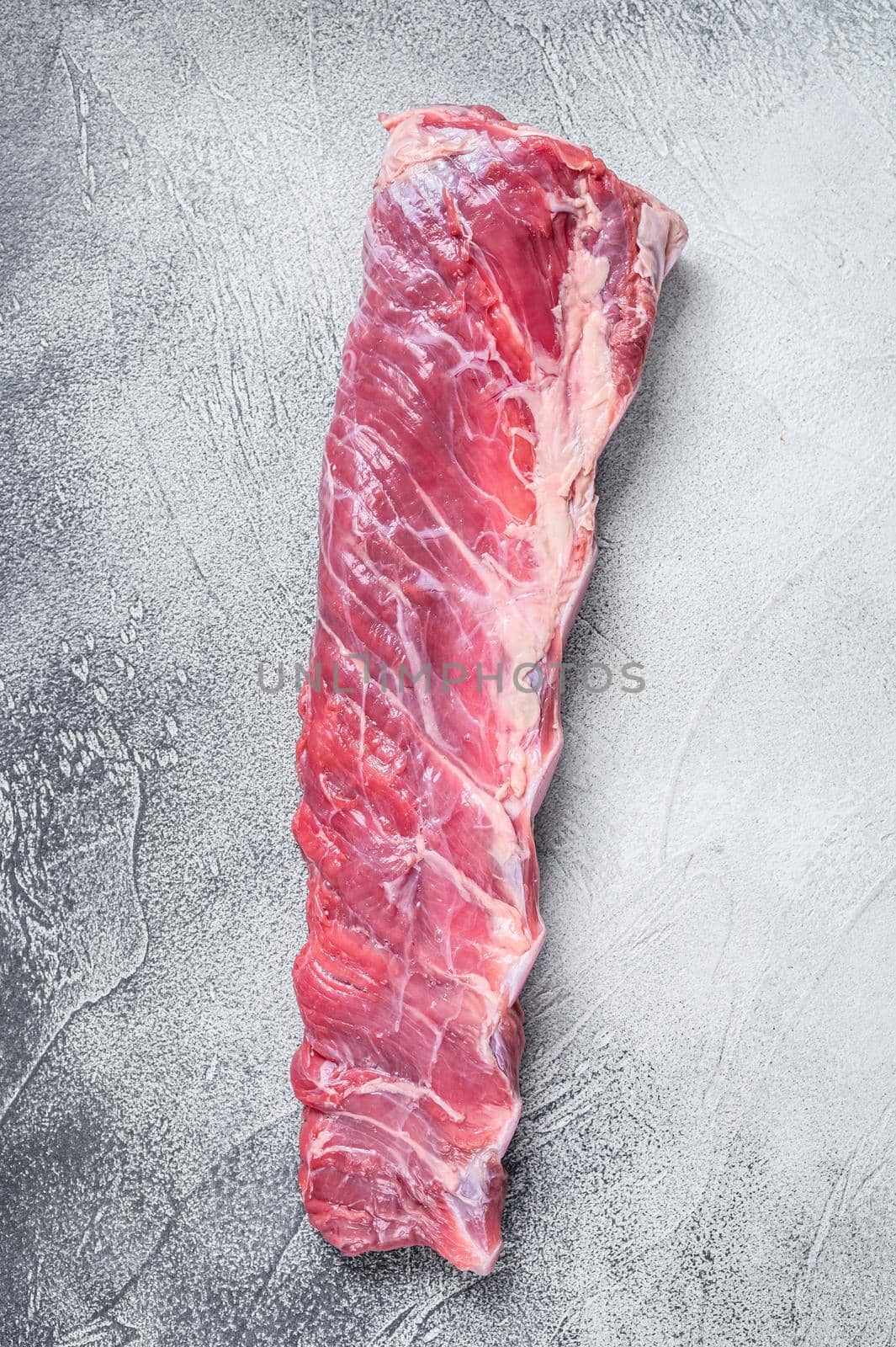 Raw veal calf short spare rib meat. White background. Top view.