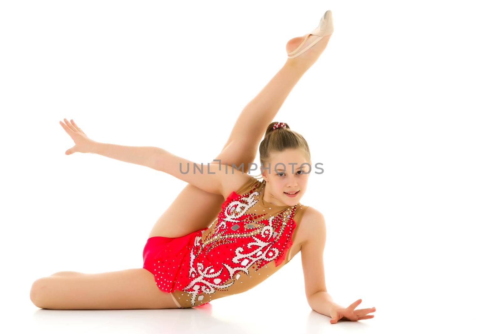 A little girl does gymnastic exercises. by kolesnikov_studio