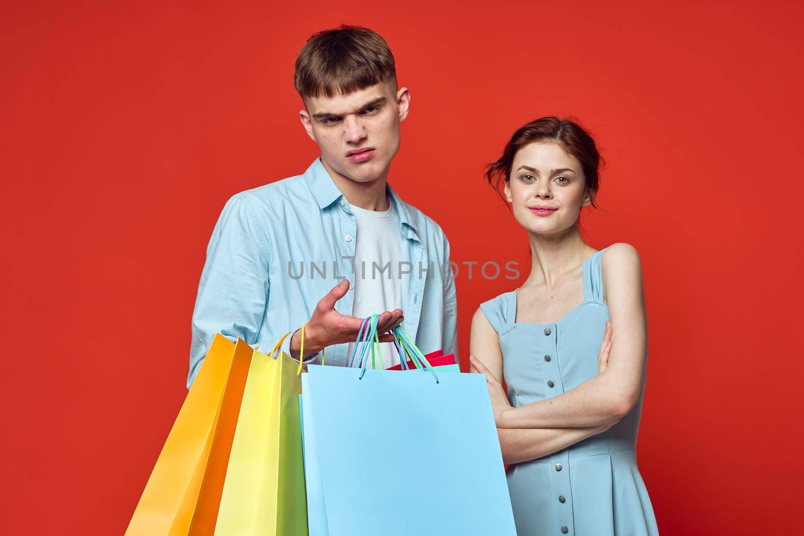 young couple with shopping bags fashion studio by Vichizh