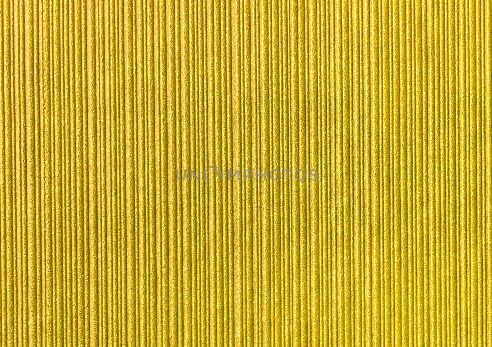 Yellow abstract striped pattern wallpaper background, gold paper texture with vertical lines.